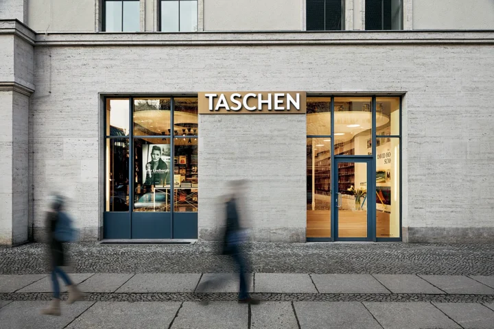 Front view of the TASCHEN Store Berlin with pedestrians passing by