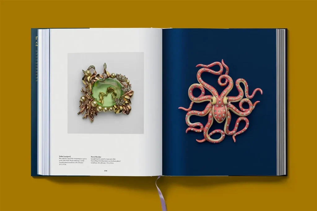 Interior spread from “Costume Jewelry” featuring a sculptural brooch with a green gemstone 
and a coral-colored octopus brooch. 
© Taschen Verlag