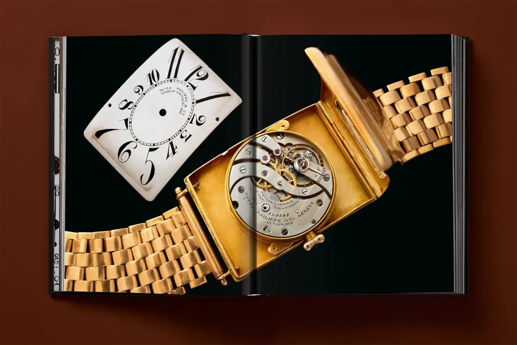 An interior page from “Ultimate Collector Watches” shows a gold wristwatch opened to reveal its mechanical movement, accompanied by the removed dial. 
 © Taschen Verlag